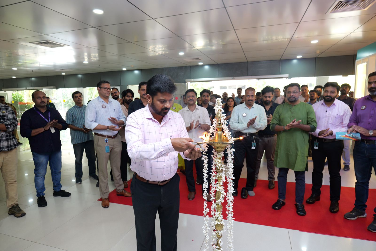 Mr. Abhilash D S, Asst. Vice President (Administration & Industrial Relations), lighting the inaugural lamp.
